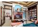 Cozy lounge area featuring a fireplace and built-in bookshelves at 14950 W Mountain View Blvd # 5101, Surprise, AZ 85374