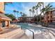 Inviting pool and spa area with lounge chairs and palm trees at 14950 W Mountain View Blvd # 5101, Surprise, AZ 85374