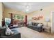 Comfortable living room with access to a private patio at 14950 W Mountain View Blvd # 5101, Surprise, AZ 85374