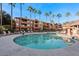 Refreshing pool with surrounding lounge chairs and building view at 14950 W Mountain View Blvd # 5101, Surprise, AZ 85374