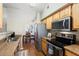 Modern kitchen with stainless steel appliances and light wood cabinets at 14950 W Mountain View Blvd # 5101, Surprise, AZ 85374