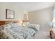 Two twin beds in a well-lit guest bedroom at 14950 W Mountain View Blvd # 5101, Surprise, AZ 85374