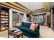 Community library with comfortable seating, bookshelves, and large windows at 14950 W Mountain View Blvd # 5101, Surprise, AZ 85374