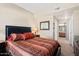 Primary bedroom with ensuite bathroom access and large windows at 14950 W Mountain View Blvd # 5101, Surprise, AZ 85374