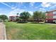 Community green space with building view and pathway at 14950 W Mountain View Blvd # 5101, Surprise, AZ 85374