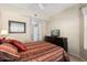 Bedroom with king bed, dresser, and ceiling fan at 14950 W Mountain View Blvd # 5101, Surprise, AZ 85374