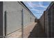 Gravel side yard with chain link fence at 30948 W Columbus Ave, Buckeye, AZ 85396