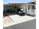 Home exterior with covered parking and patio furniture at 650 N Hawes Rd # 3530, Mesa, AZ 85207