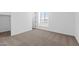 Bedroom with neutral carpeting and walk-in closet at 37520 W Padilla St, Maricopa, AZ 85138