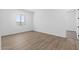 Spacious bedroom with wood-look flooring and neutral walls at 37520 W Padilla St, Maricopa, AZ 85138