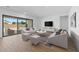 Bright living room with sliding glass doors leading to backyard at 37520 W Padilla St, Maricopa, AZ 85138