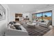Open concept living room showcasing kitchen and backyard views at 37520 W Padilla St, Maricopa, AZ 85138