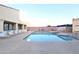 Community swimming pool and spa with lounge chairs at 12221 W Bell Rd # 335, Surprise, AZ 85378