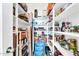 Large walk-in pantry with ample shelving for food storage at 17750 W Pershing St, Surprise, AZ 85388
