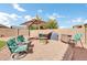 Outdoor patio with fire pit and seating area at 17750 W Pershing St, Surprise, AZ 85388