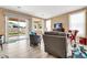 Bright living room with sliding glass doors leading to the backyard at 17750 W Pershing St, Surprise, AZ 85388