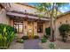Home's entryway with a pergola and mature landscaping at 28080 N 101St St # 116, Scottsdale, AZ 85262