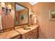Powder room with copper sink and patterned wallpaper at 28080 N 101St St # 116, Scottsdale, AZ 85262