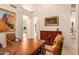 Elegant home office features a large desk, comfortable chairs, and built-in cabinetry at 28080 N 101St St # 116, Scottsdale, AZ 85262