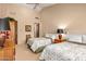 Bedroom with two twin beds, wooden furniture, and window at 28080 N 101St St # 116, Scottsdale, AZ 85262