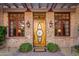 Detailed view of the home's entryway door and stone facade at 28080 N 101St St # 116, Scottsdale, AZ 85262