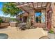 Patio with seating, pergola, and built in grill at 28080 N 101St St # 116, Scottsdale, AZ 85262