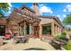 Relaxing patio with pergola, seating, and a spa at 28080 N 101St St # 116, Scottsdale, AZ 85262