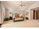Spacious bedroom with a king-size bed, ceiling fan and ample natural light at 28080 N 101St St # 116, Scottsdale, AZ 85262