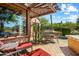 Patio with seating area, pergola, and views of desert landscaping at 28080 N 101St St # 116, Scottsdale, AZ 85262