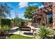 Outdoor patio area with seating and a built-in grill at 28080 N 101St St # 116, Scottsdale, AZ 85262