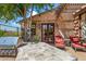 Outdoor kitchen and patio area with seating and a pergola at 28080 N 101St St # 116, Scottsdale, AZ 85262
