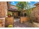 Ornate iron gate leads to the home's entrance at 28080 N 101St St # 116, Scottsdale, AZ 85262
