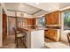 Gourmet kitchen with island, custom cabinetry and breakfast bar at 28080 N 101St St # 116, Scottsdale, AZ 85262