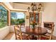 Charming dining room with fireplace and large windows at 28080 N 101St St # 116, Scottsdale, AZ 85262