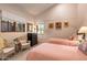 Serene bedroom with twin beds, wicker chairs and soft natural light at 28080 N 101St St # 116, Scottsdale, AZ 85262
