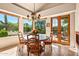 Bright dining room with french doors leading to patio at 28080 N 101St St # 116, Scottsdale, AZ 85262