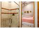 Bathroom with a glass shower, tiled walls, and modern vanity at 28080 N 101St St # 116, Scottsdale, AZ 85262