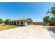 House exterior with a large concrete driveway at 25413 W Pueblo Ave, Buckeye, AZ 85326