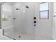 Large walk-in shower with dual shower heads and built-in seat at 37645 W Padilla St, Maricopa, AZ 85138