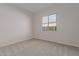 Bright bedroom with neutral walls and carpet flooring at 20230 W Hollyhock St, Buckeye, AZ 85396