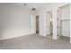Bedroom with carpet flooring and access to bathroom and closet at 20230 W Hollyhock St, Buckeye, AZ 85396