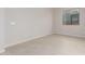 Simple bedroom with neutral walls and wood-look tile floor at 20230 W Hollyhock St, Buckeye, AZ 85396