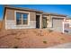 House exterior with new landscaping and two-car garage at 20230 W Hollyhock St, Buckeye, AZ 85396