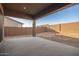 Covered patio with concrete flooring and backyard access at 20230 W Hollyhock St, Buckeye, AZ 85396