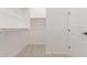 Spacious walk-in closet with ample shelving and hanging rods at 20230 W Hollyhock St, Buckeye, AZ 85396