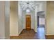 Bright entryway with hardwood floors and a wood door at 20911 E Excelsior Ave, Queen Creek, AZ 85142