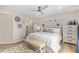 Main bedroom with wood-like platform bed and ceiling fan at 9824 W Kerry Ln, Peoria, AZ 85382