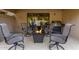 Relaxing patio with fire pit and outdoor seating at 9824 W Kerry Ln, Peoria, AZ 85382