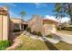Spanish style home with a two car garage and nicely landscaped yard at 9824 W Kerry Ln, Peoria, AZ 85382