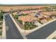 Single-story house with a two-car garage, landscaping, and a neighborhood view at 26568 W Cat Balue Dr, Buckeye, AZ 85396